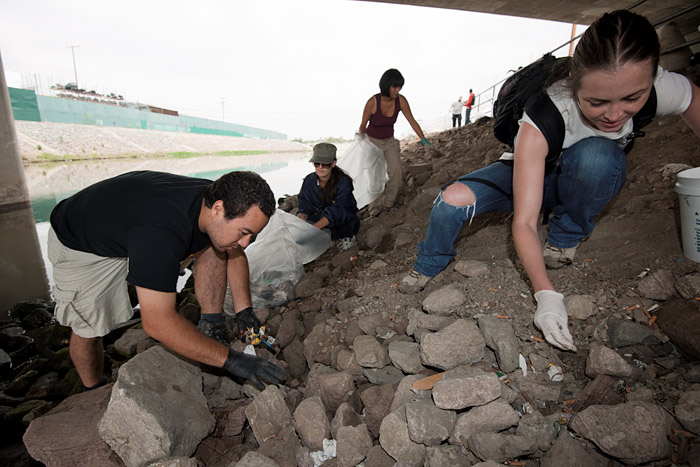 Members of the Earth Sciences Club of Cal State University at Dominguez Hills work together to clean the area.