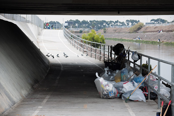 By the end of the event, the debris from the homeless encampment is bagged.
