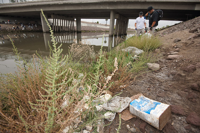 A used container of paint thinner lies along the heavily polluted waterway. The area was labeled one of five code red sites in Los Angeles by Heal the Bay engineers due to the large amount of waste accumulated there.