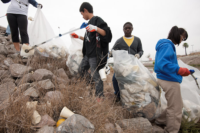 Students of Serra High School, a private Catholic school in Gardena, must complete twenty hours of community service yearly. According to a teacher working alongside the students, the main reason the community takes care of the local environment is because 