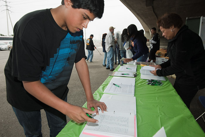 A student signs up for a morning of community service.