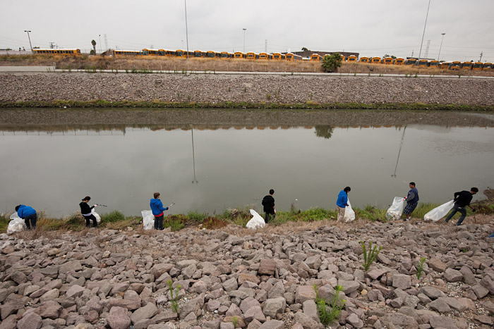Students work near the site of the old Ascot Park dirt racetrack and across the channel from the L.A. Unified School District garage.