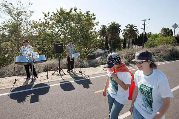 Musicians play the steel drums to entertain volunteers as they enter the Willows Street Estuary.